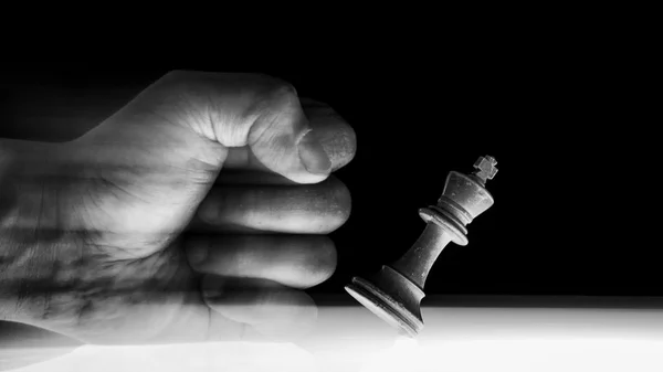 Human Fist Punches over a King Chess Piece — Stock Photo, Image