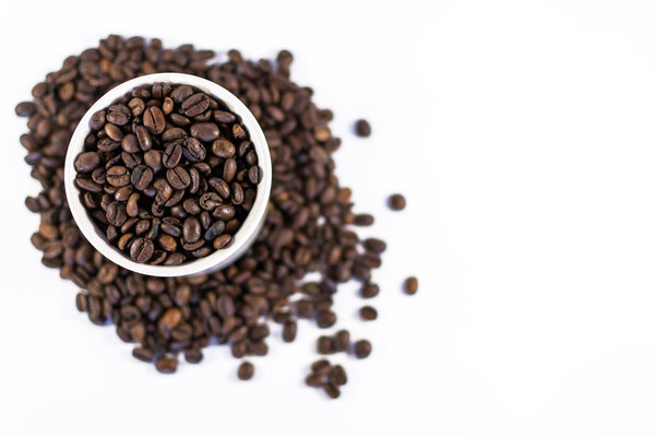 Overhead Roasted Coffee Beans in a Cup using defocus with copyspace