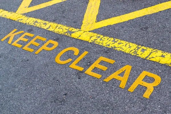 stock image Keep Clear Yellow Paint on Asphalt