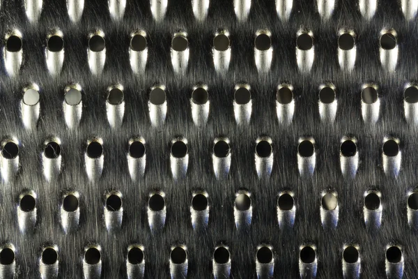 Makrobild av en begagnad ostrivjärn — Stockfoto
