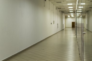 Deserted Empty Corridor with Glass and White Paint
