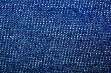 Mavi kot pantolon desenli dikişli arka plan, yakın plan, sığ alan derinliğinde odak seç