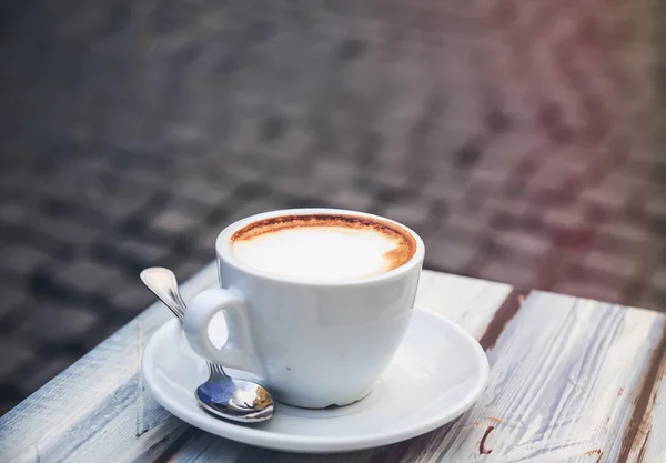 Morning light cup of cappuccino, cup of coffee, cup of coffee on brown wooden table