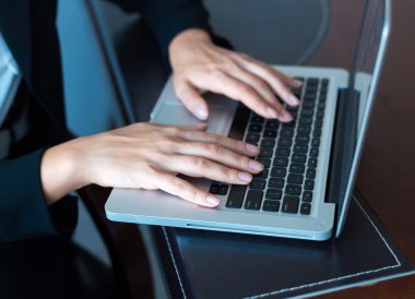 Businessperson using laptop computer