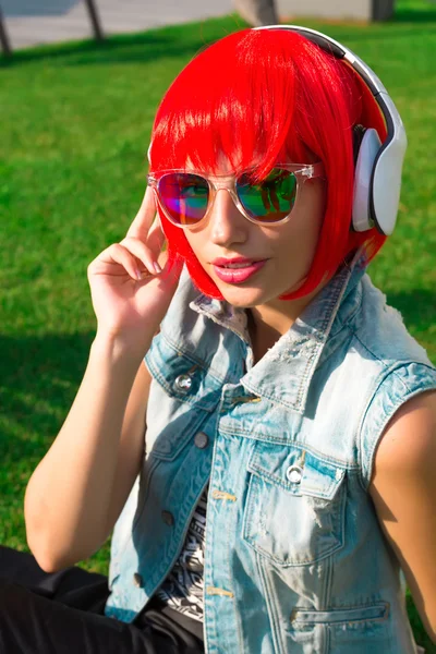 Outdoor summer portrait of girl listening music