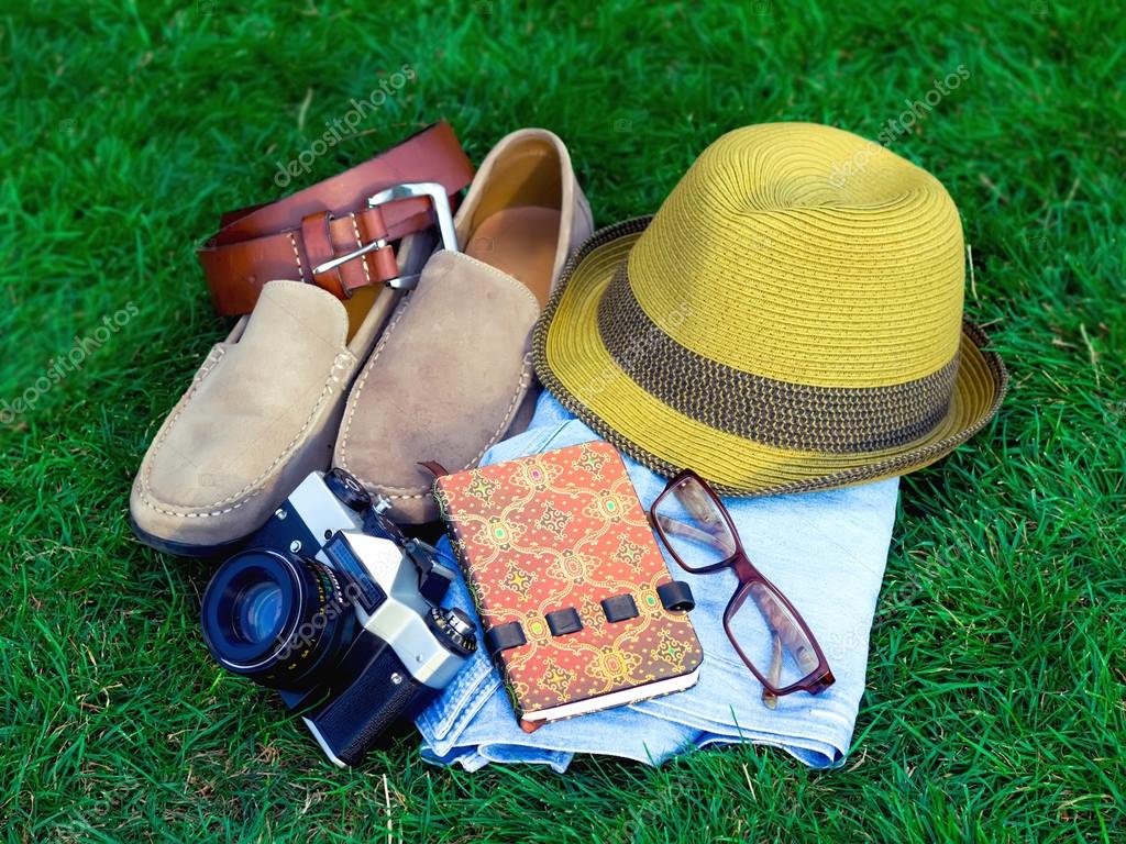 Spring or summer men's fashion accessories lying on grass Stock