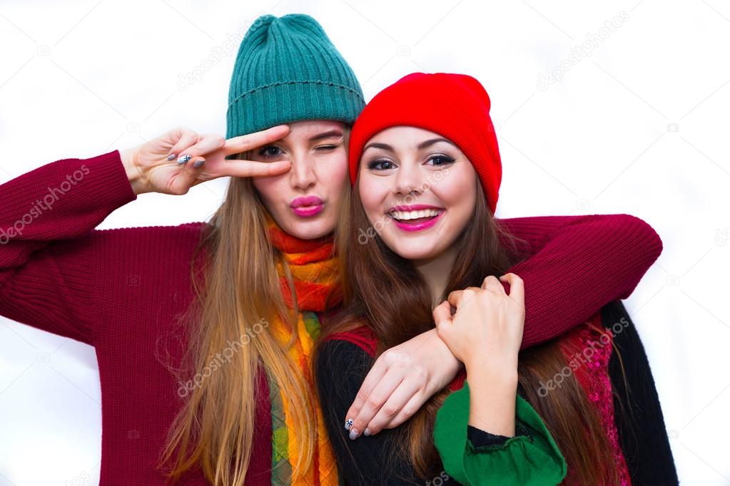 Two young teenage hipster girl friends together.