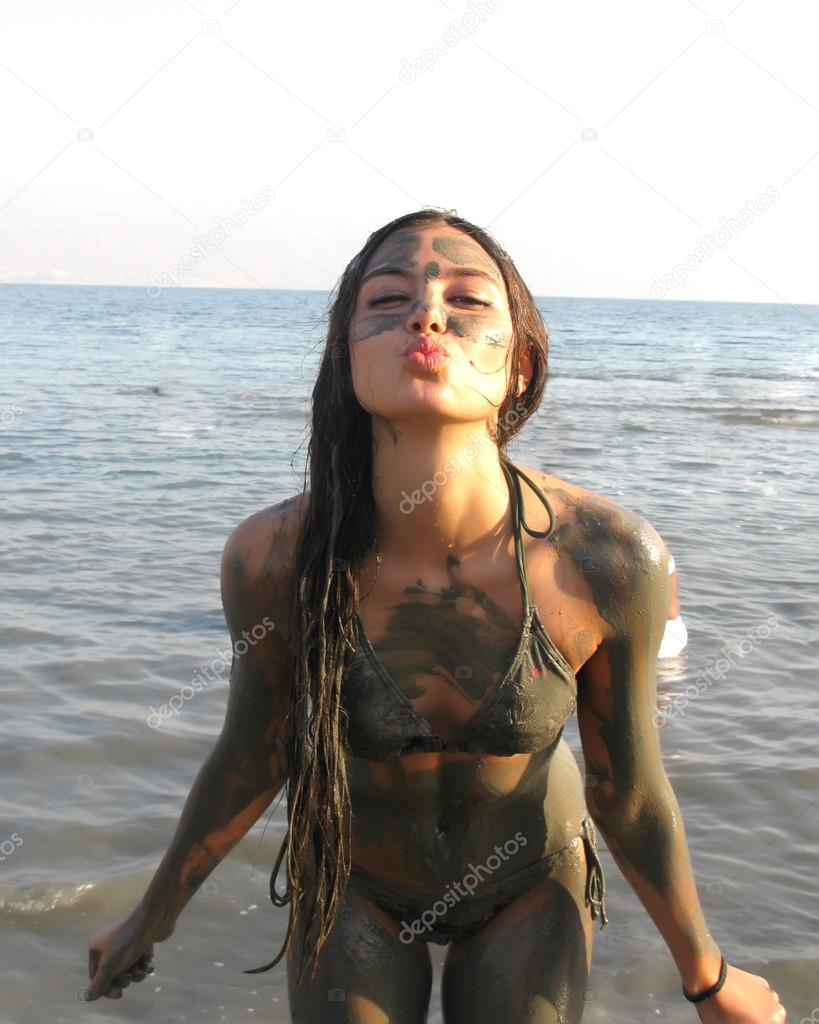 Spa Outdoor, Beautiful young woman lwith natural dead sea body mask.