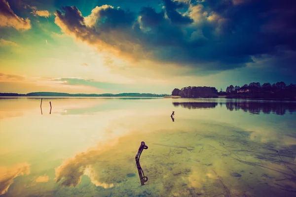 Vintage photo of sunset over calm lake — Stock Photo, Image