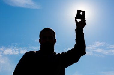 Man shows sun eclipse clipart