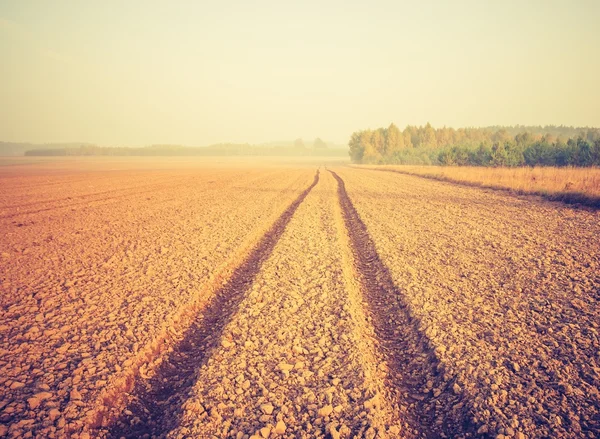 Vintage photo of plowed field — Stock Photo, Image