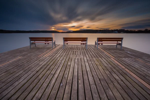 Lake with pier and benches. — Stock Photo, Image