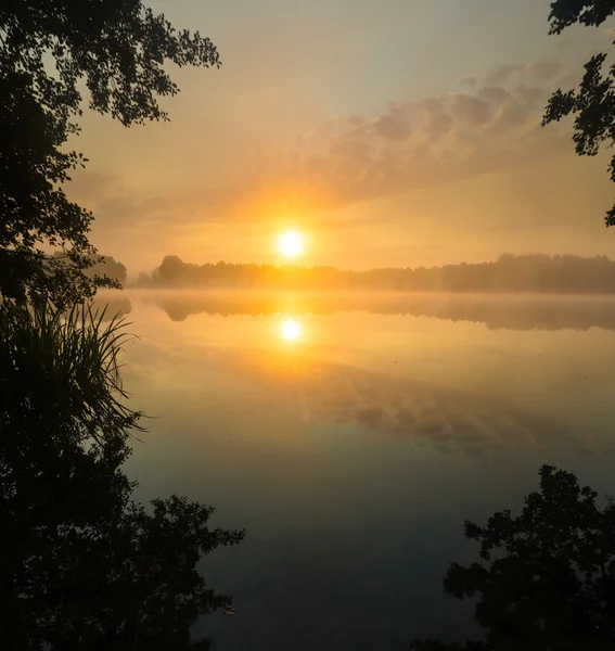 Mystic sunrise over lake — Stock Photo, Image