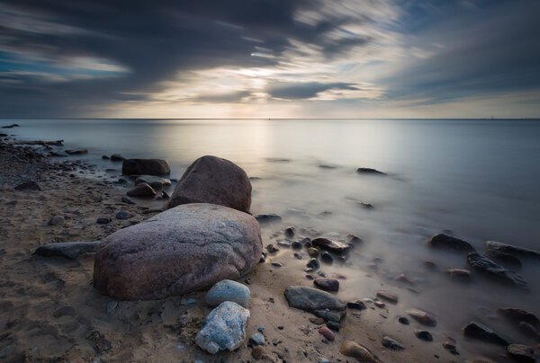 Rocky sea shore, long exposure photo
