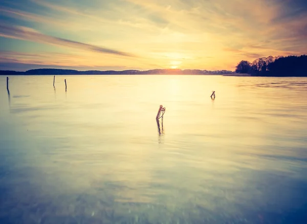 Sunset over calm lake — Stock Photo, Image