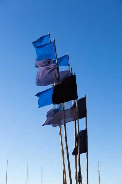 Flags on fisherman boats — Stock Photo, Image