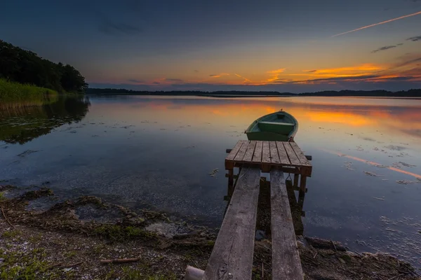 Sunset with fisherman boat — Stock Photo, Image