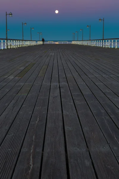 Beautiful wooden pier on Baltic sea shore — Stock Photo, Image