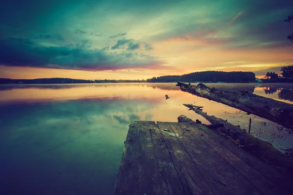 Vintage photo of beautiful sunset over calm lake — Stock Photo, Image