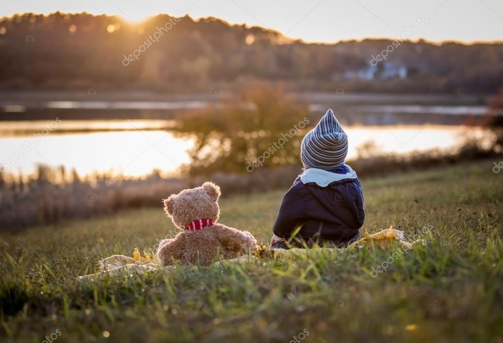 Boy And Teddy Bear Watching Sunset Stock Photo C Milosz