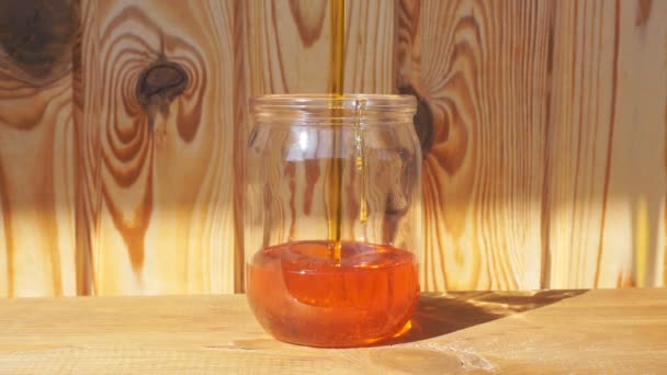 Pouring Natural Honey Glass Jar — Stock Video