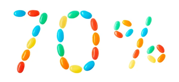 70% буквы из разноцветных конфет, изолированных на белом — стоковое фото