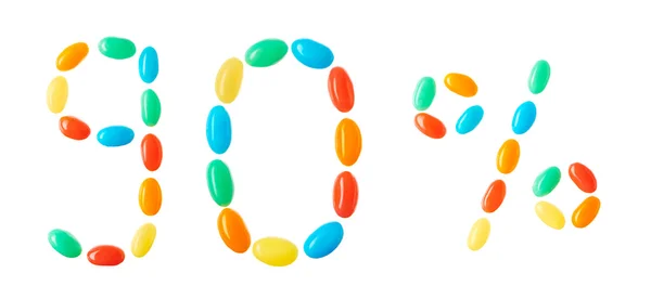 90% lettering composto da caramelle multicolori isolate su bianco — Foto Stock