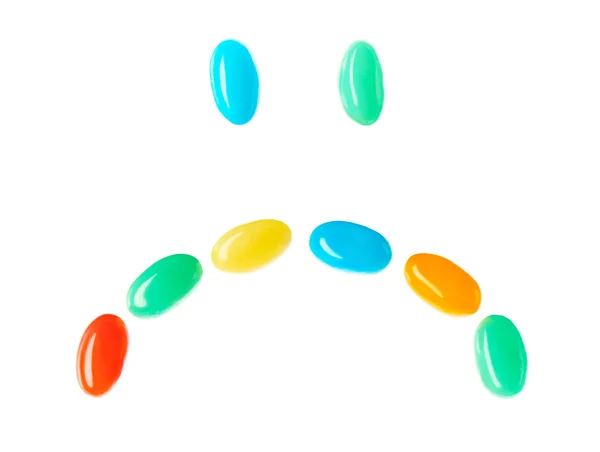 Upset sad smiley made of multicolored candies — Stock Photo, Image