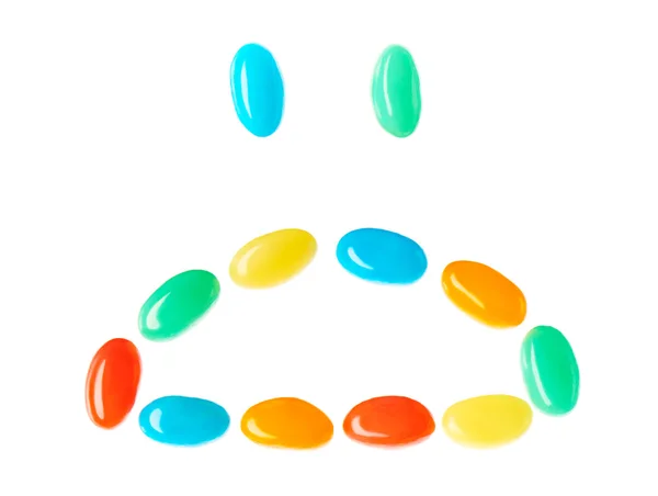 Trauriger Smiley aus bunten Bonbons — Stockfoto