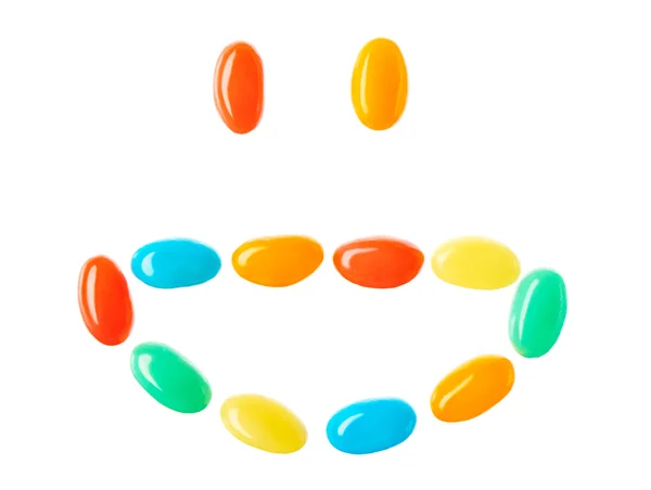 Sorriso sorridente feliz feito de doces multicoloridos — Fotografia de Stock