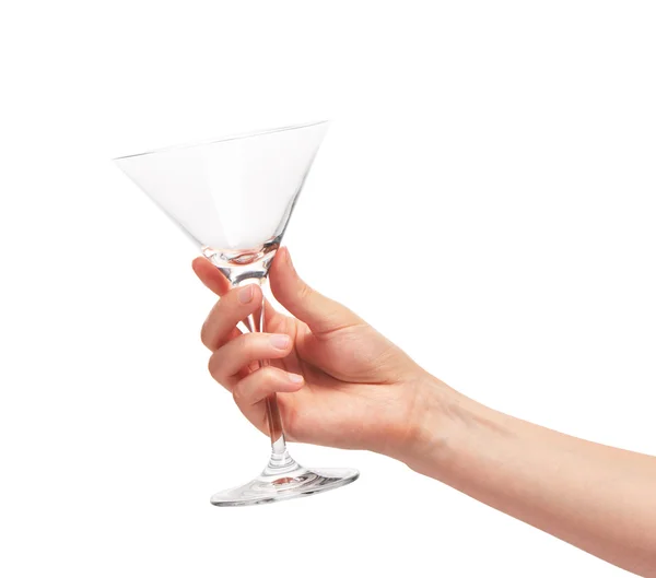 Main féminine tenant vide verre de martini propre contre blanc — Photo