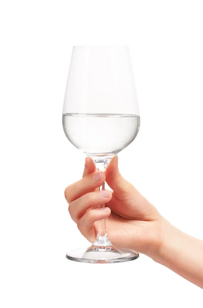 Female hand holding wine glass with water — Stock Photo, Image