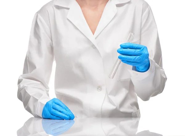 Female in gown and gloves holding empty glass test tube — Stock Photo, Image