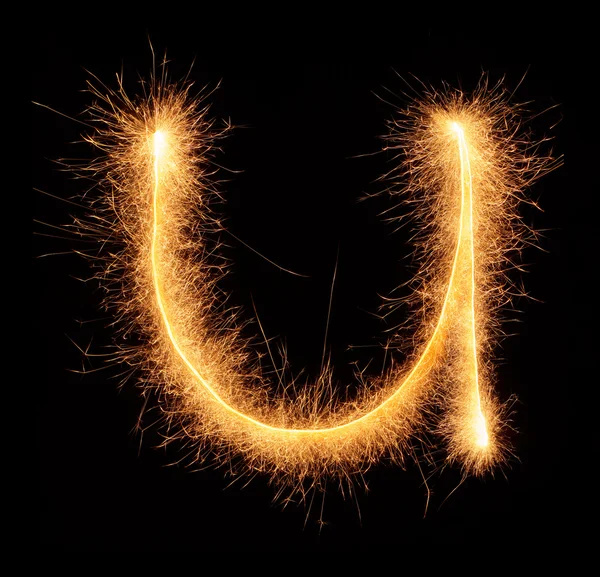 "U "carta desenhada com brilhos bengali — Fotografia de Stock