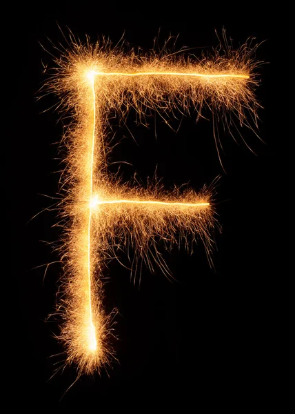"F "carta desenhada com brilhos bengali — Fotografia de Stock