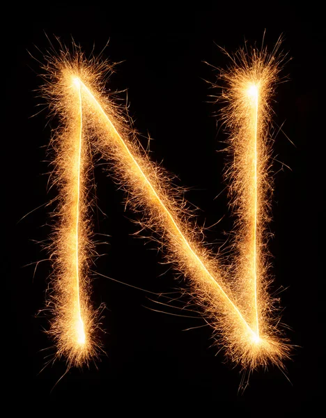 "N "carta desenhada com brilhos bengali — Fotografia de Stock