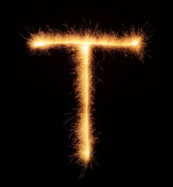 "T "carta desenhada com brilhos bengali — Fotografia de Stock