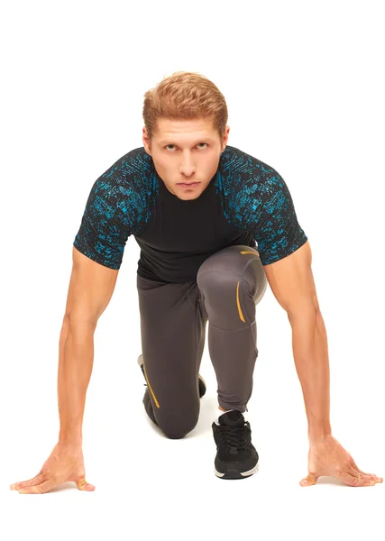 Young muscular handsome sportsman preparing to start running — Stock Fotó
