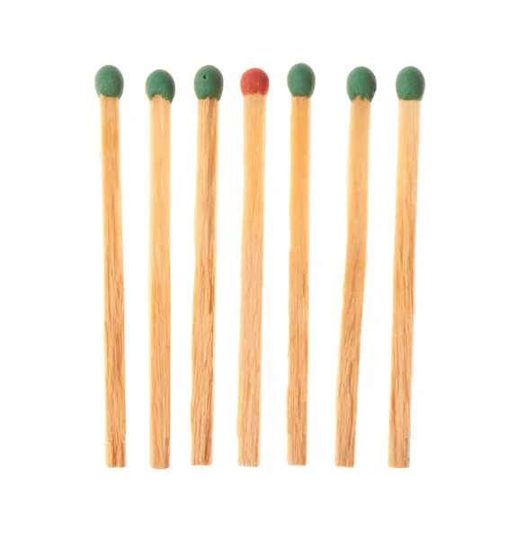 Set of six green and one red wooden matches — Stock fotografie