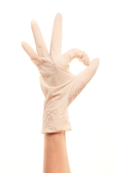 Doctor's hand in white sterilized surgical glove showing OK sign — Stok fotoğraf