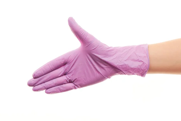 Doctor's hand in purple sterilized surgical glove giving for handshake — Stockfoto