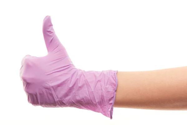 Doctor's hand in purple surgical glove showing thumbs up sign — Stockfoto