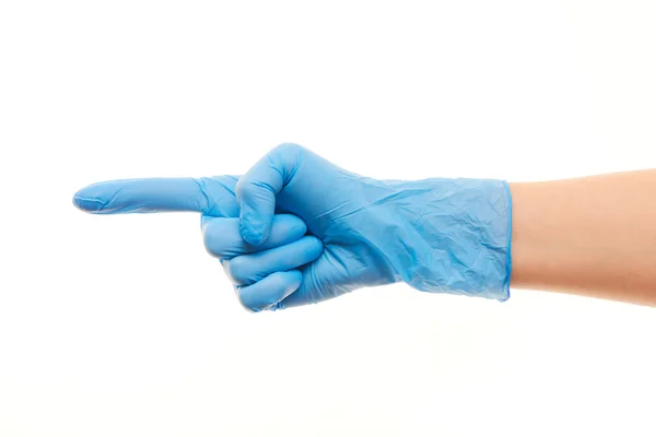 Vrouwelijke arts hand in blauwe chirurgische handschoen wijzen op iets — Stockfoto