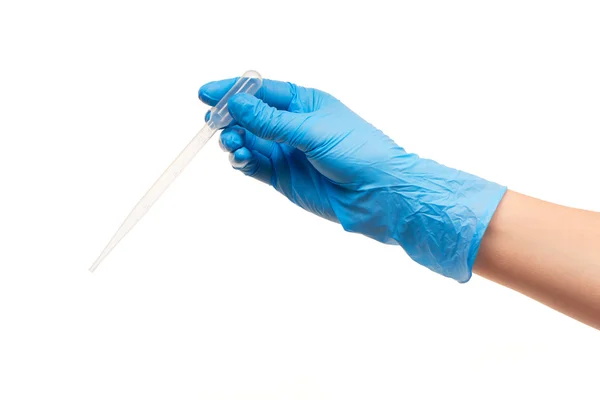 Close up of female doctor's hand in blue sterilized surgical glove with plastic medical dropper — Stock Photo, Image