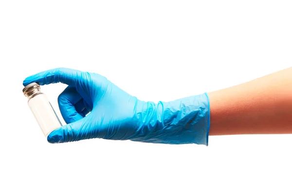 Female doctor's hand in blue sterilized surgical glove holding empty transparent white glass ampoule against white background — Stock Photo, Image