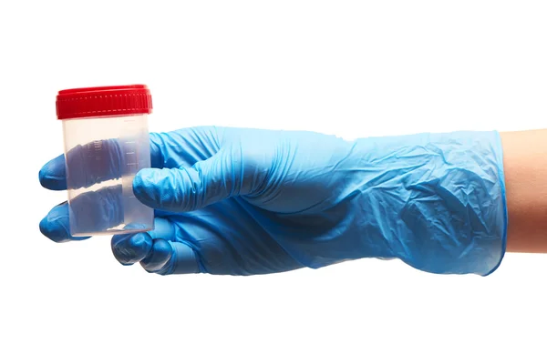 Doctor's hand in blue sterilized surgical glove holding empty transparent plastic sterile specimen collection container — Stock Photo, Image