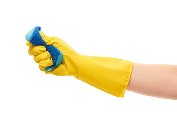 Female hand in yellow protective glove squeezing blue cleaning sponge — 스톡 사진