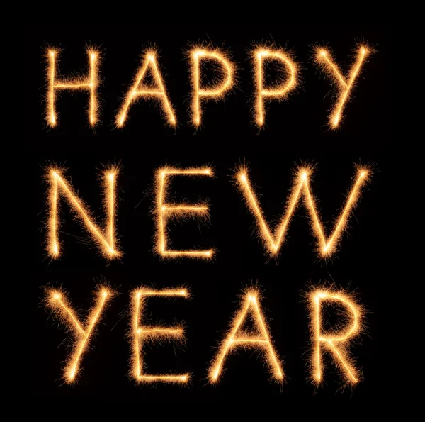 Lettering "HAPPY NEW YEAR" desenhado com espumantes bengali — Fotografia de Stock