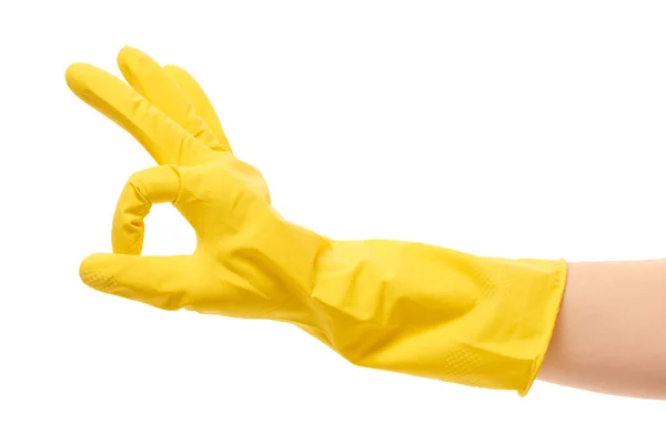 Female hand in yellow protective glove showing OK sign — 스톡 사진