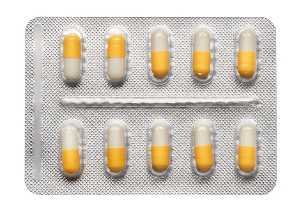 Blister pack of yellow and white capsules — Stock Photo, Image